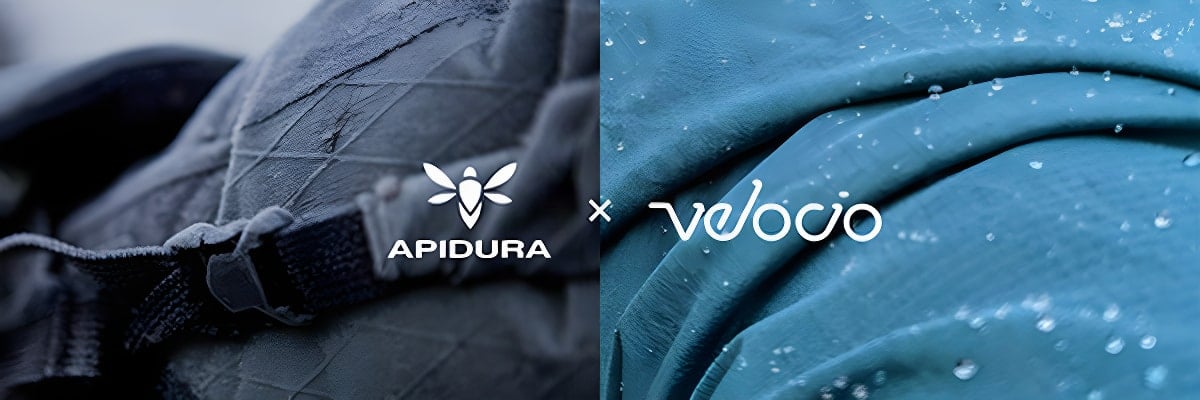 Apidura and Velocio logos over close-up shots of black and teal wet-weather fabric.