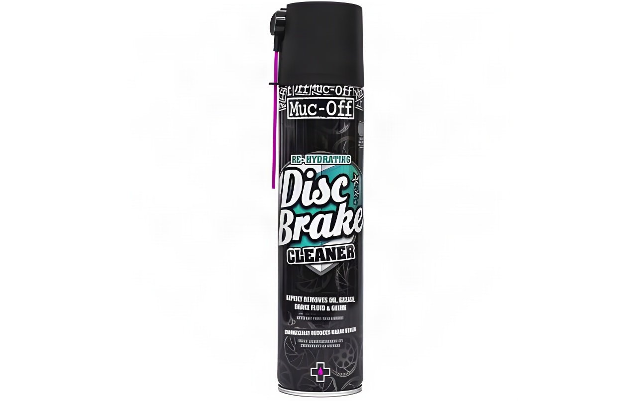 Muc-Off Disc Brake Cleaner aerosol can in black with a pink spray straw, on a white background.