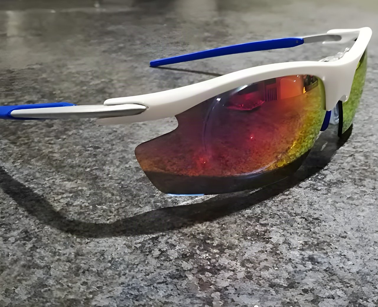 Optilabs Swift varifocal cycling glasses with a white frame, blue arms and red-mirrored shield.