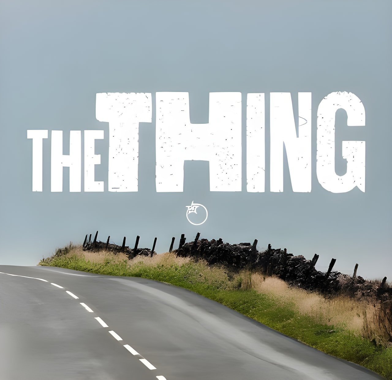 Title card for Orange Bikes' RX9 video The Thing, white lettering above a moorland road.