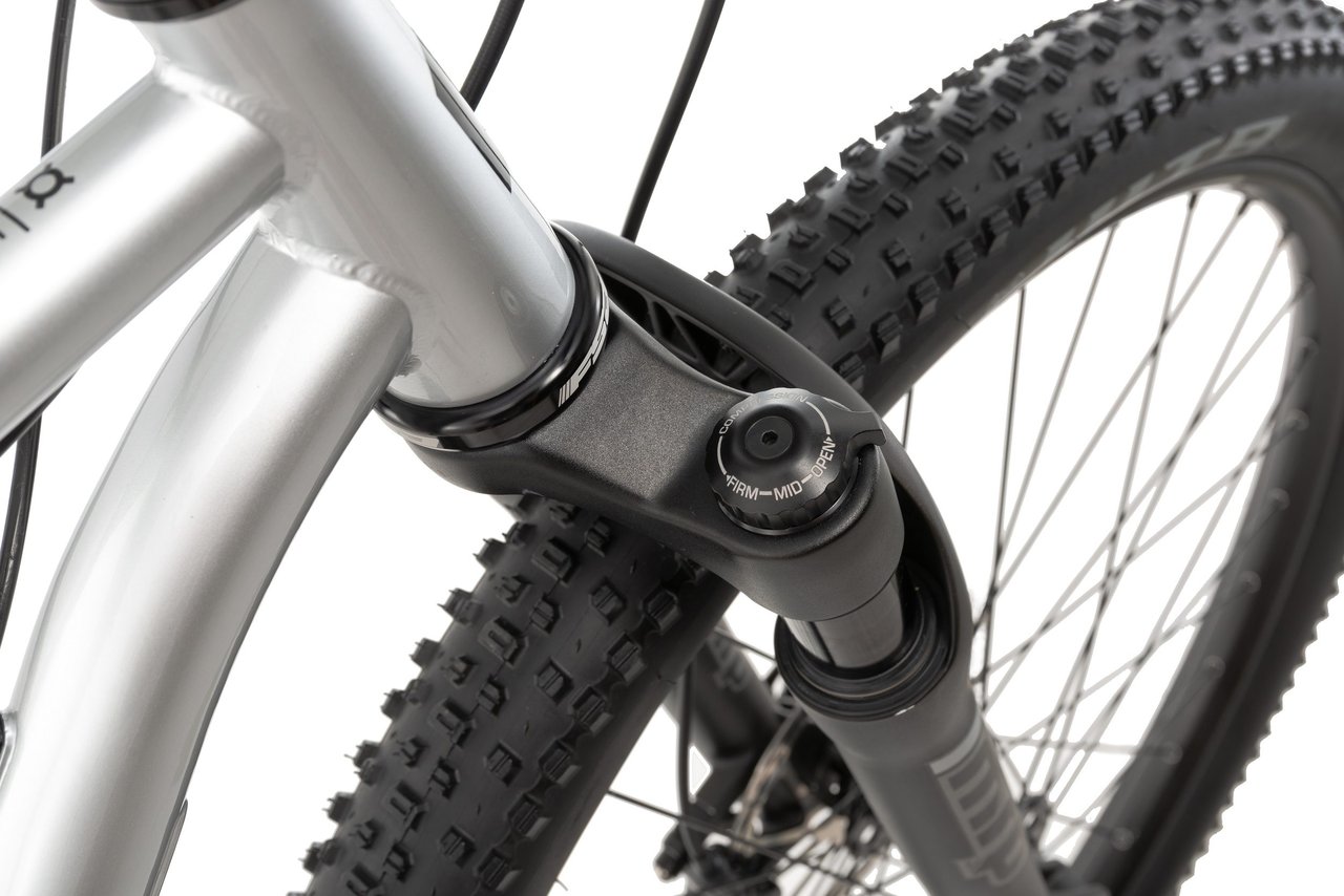 MRP Baxter suspension fork crown on the Bombtrack Hook ADV, with its firm, mid and open compression dial beside a WTB tyre.