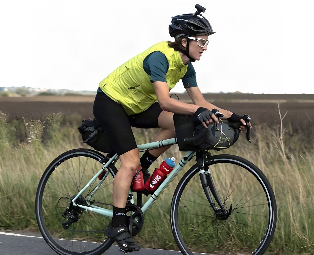 Ede Harrison, fastest woman at Transcontinental Race No6, rides her pale green Light Blue Wolfson with bikepacking bags.