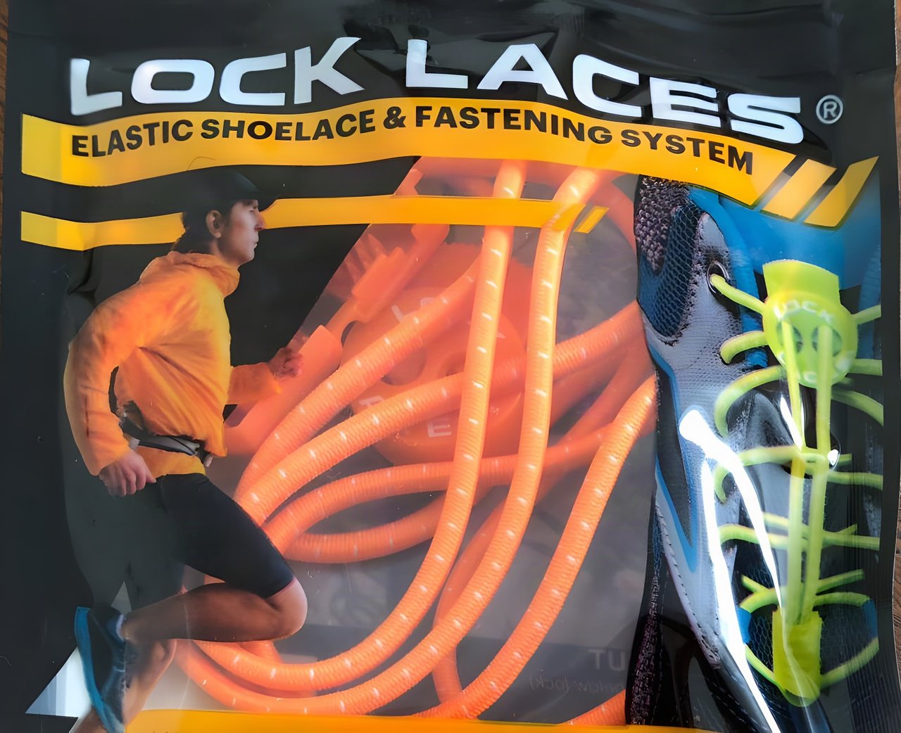 Packet of orange Lock Laces, the elastic shoelace and fastening system, with a runner pictured on the front.