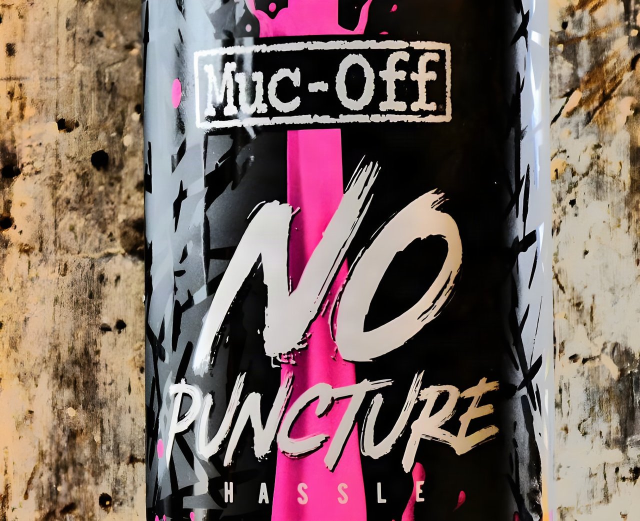 Close-up of the Muc-Off No Puncture Hassle tubeless sealant bottle label.