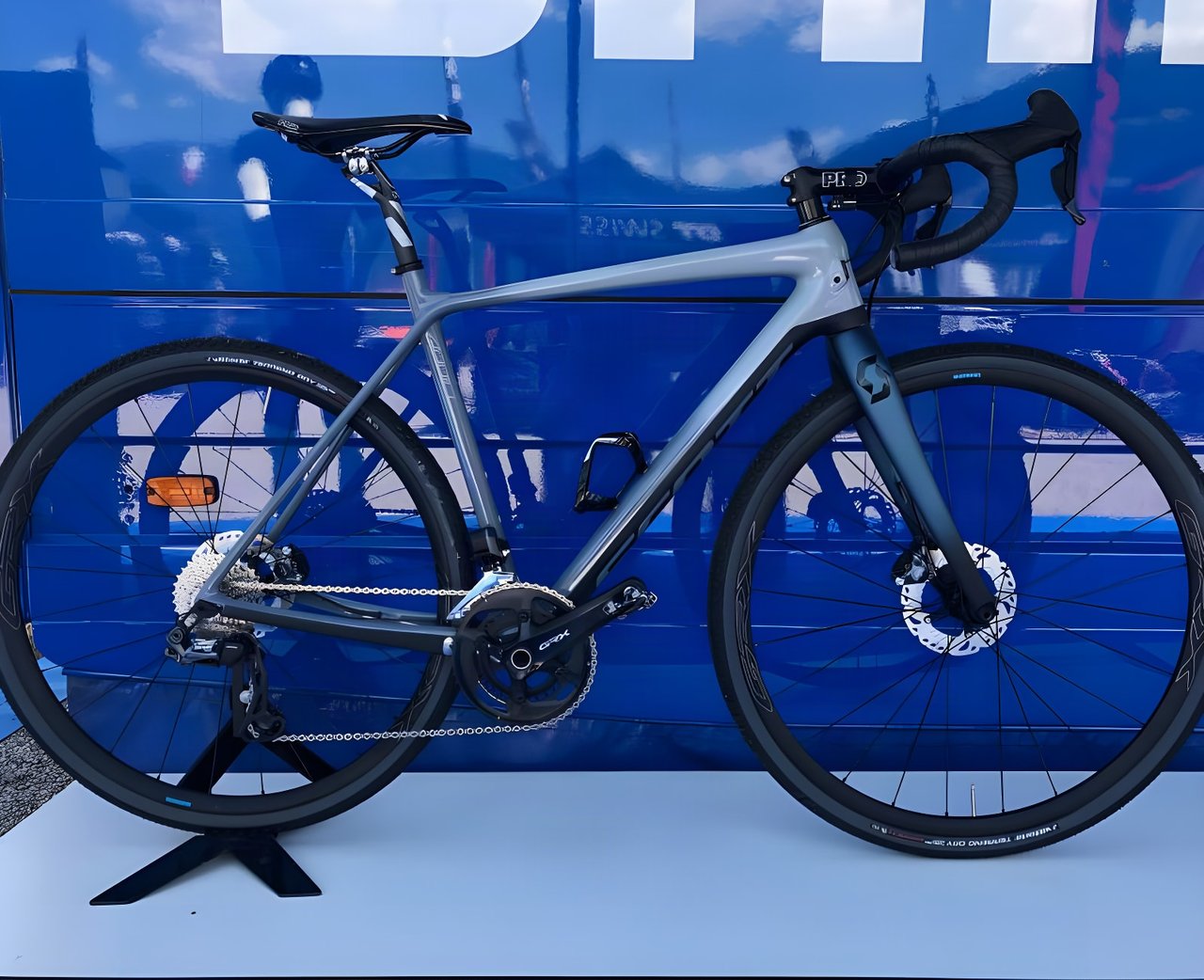 Grey gravel bike fitted with the Shimano GRX Di2 electronic groupset, on a stand at the Eurobike Media Days press camp.