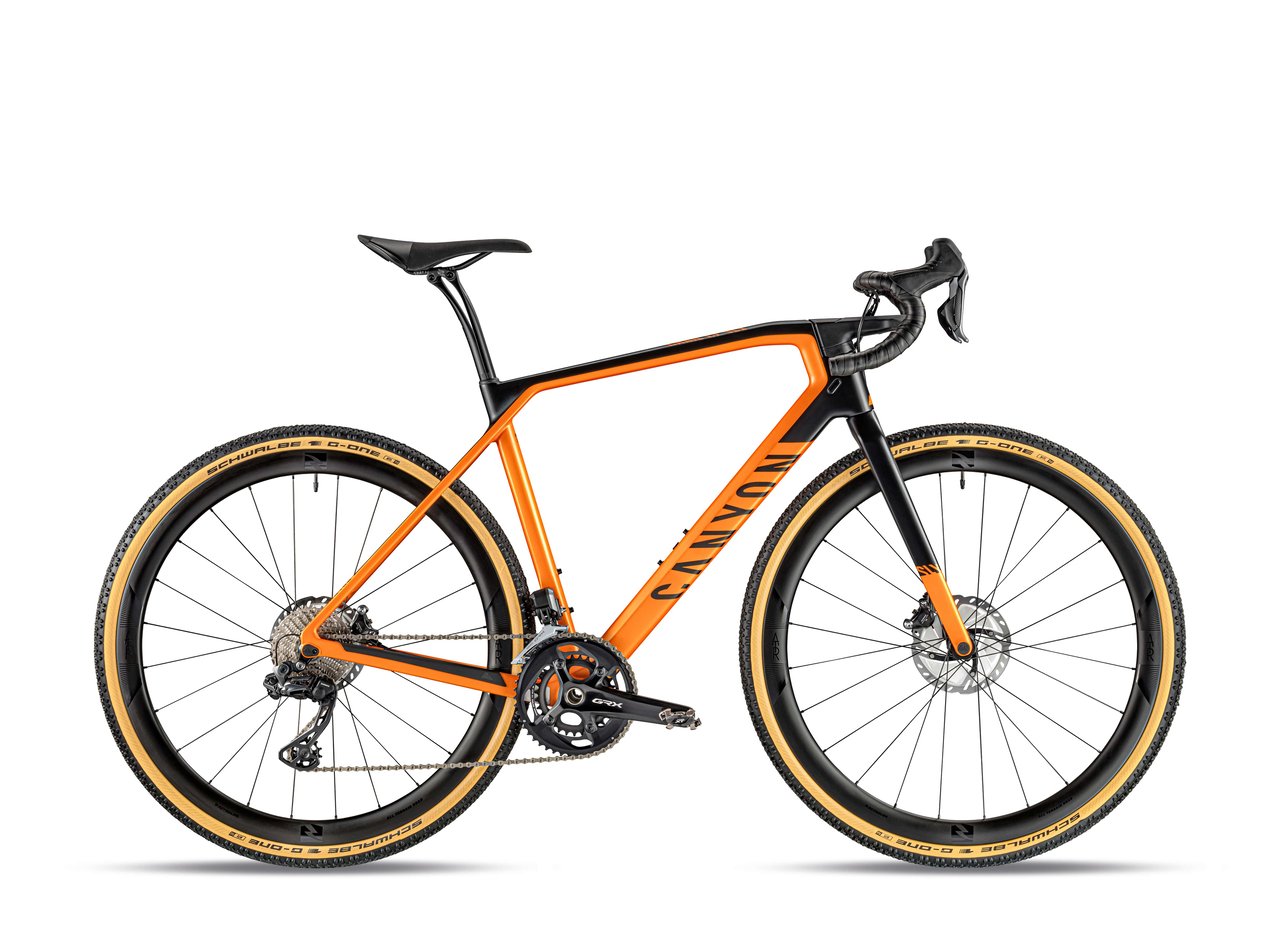 Canyon Grail CF SLX 8 Di2 in orange and black with Shimano GRX Di2 and hover bar, side view.