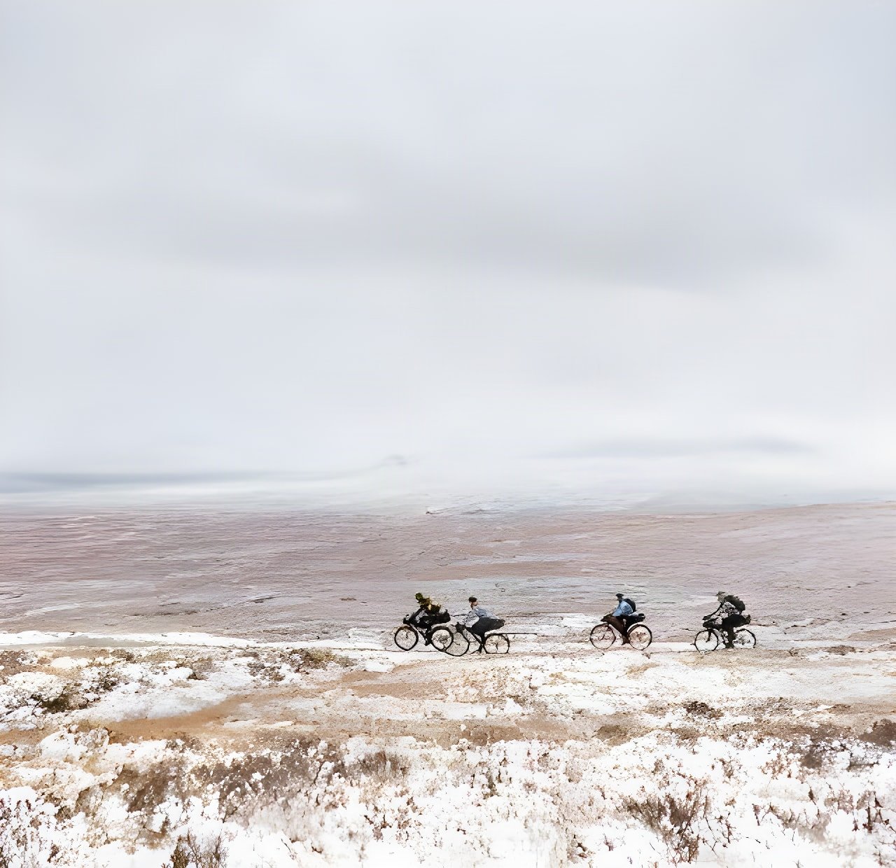 Four bikepackers ride a snowy moorland ridge in the Scottish Highlands in Pannier and Brother Cycles' film Rainspotting.