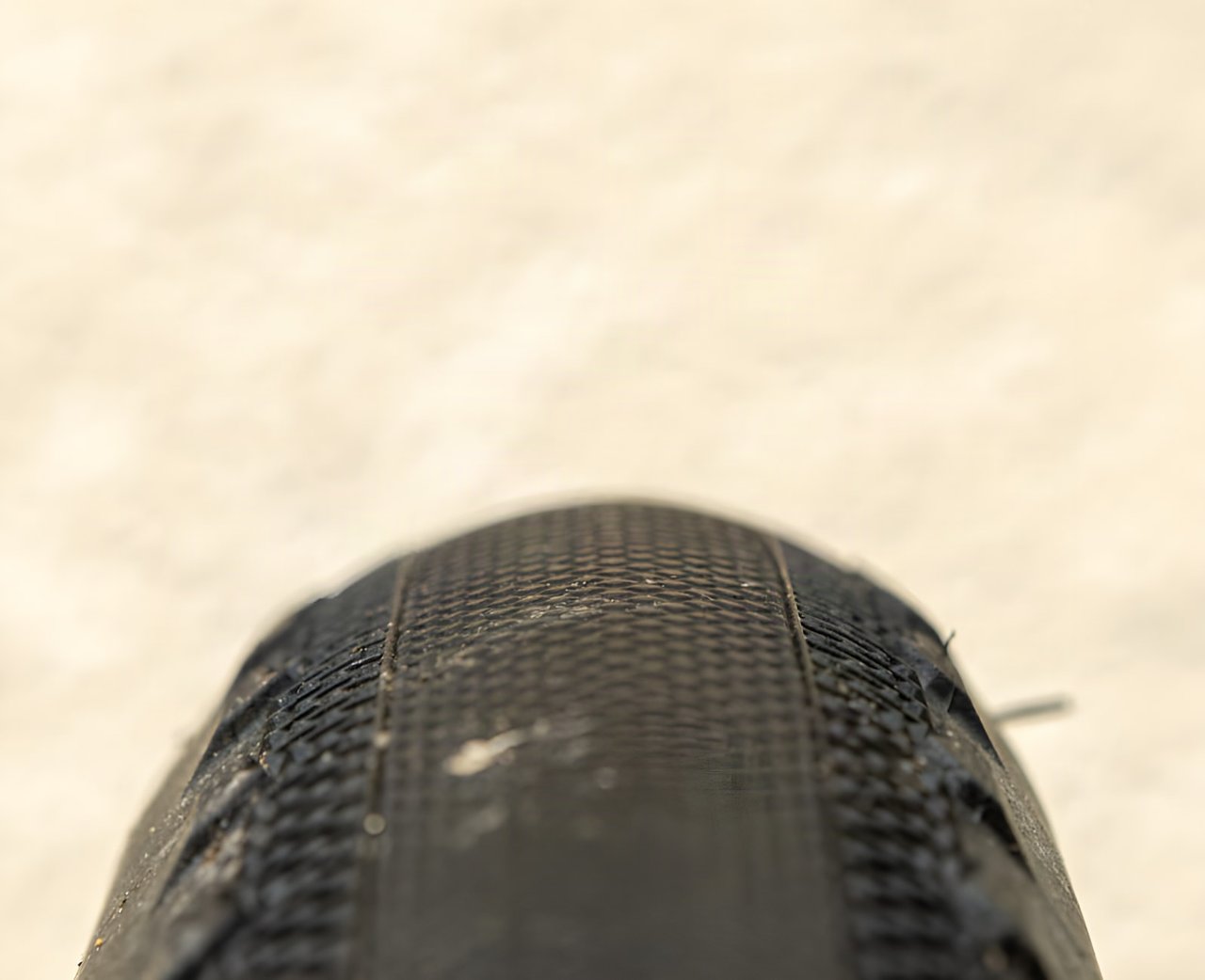 Close-up of the shallow rolling-surface tread on a Maxxis Receptor 40mm gravel tyre.