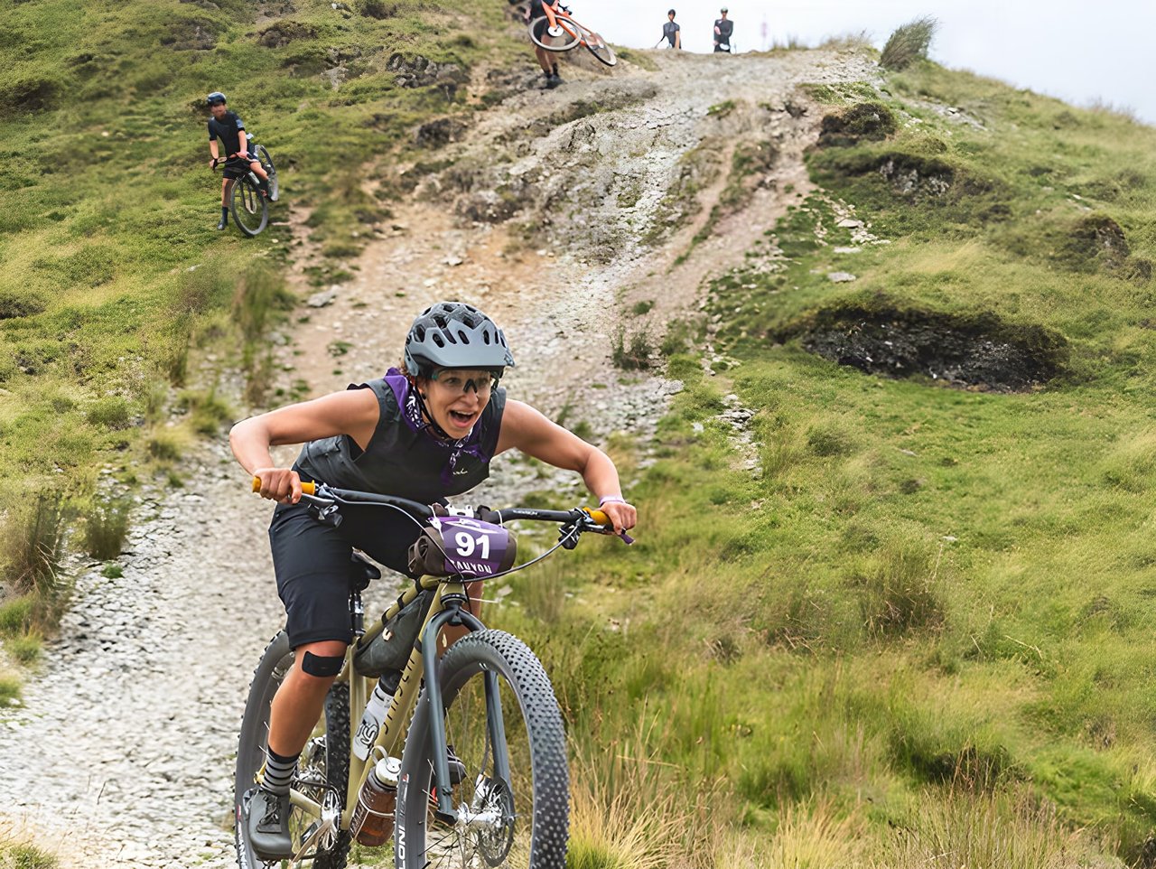 Taylor Doyle races a Stayer Cycles bike down a rocky hillside track on a timed descent at Grinduro 2021 in Wales.