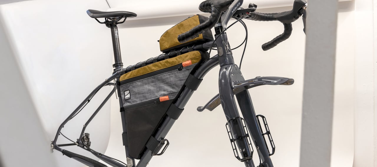 StraightCut Designs bespoke frame bag and top tube bag in mustard, grey and black on a Mason ISO.