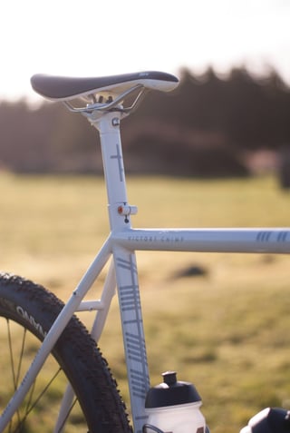 Fabric Scoop saddle and seatpost on the Donard x Victory Chimp gravel bike, with a bottle on the seat tube.