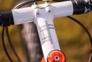 Close-up of the stem and drop bars on the Donard x Victory Chimp Gairbhéal bike, with Ogham stripes on the stem.