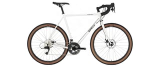 Complete white Surly Midnight Special with disc brakes and a double chainset, side view on a white background.