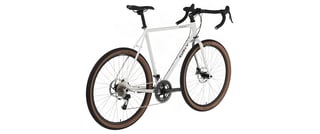 Surly Midnight Special complete bike with drop bars and tan-wall tyres, rear three-quarter view.