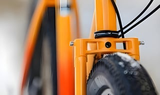 Gorilla Monsoon steel fork crown and head tube from the front, with a front tyre sitting close beneath it.