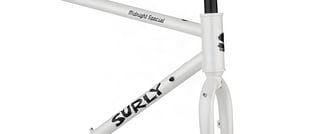 Surly Midnight Special head tube, down tube logo and fork crown on the white steel frameset.
