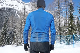 Back of the Gore Wear Power Trail Primaloft jacket, worn with The One trousers and gloves in the snow.