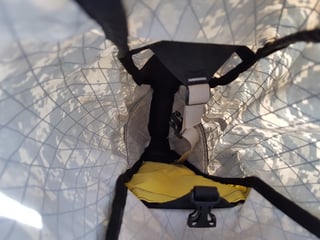 Inside the camouflage Revelate Viscacha seat pack, showing the internal strap and tapered section.