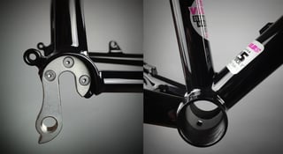 Close-ups of the Fearless Vulture's replaceable derailleur hanger and threaded bottom bracket shell on a black frame.