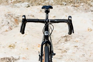 Front view of the Bombtrack Audax cockpit, showing the flared drop bars and black stem.