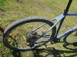Rear wheel and drivetrain of the Lauf True Grit, with a Maxxis Rambler tyre, SRAM cassette and Easton crank.