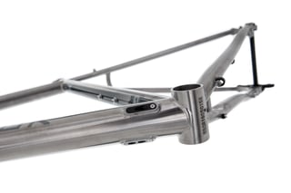 Threaded bottom bracket shell and cable ports on a Kinesis GTD titanium frame.