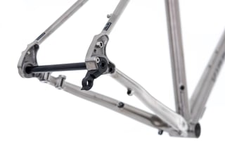 Kinesis GTD rear dropout with thru axle and replaceable derailleur hanger.