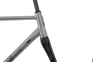 Kinesis GTD head tube, down tube cable port and carbon fork crown in close-up.