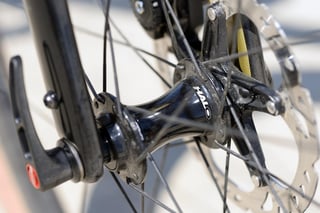 Halo GXC Supadrive centrelock front hub, close up with disc rotor and quick-release skewer.