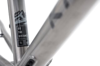 Kinesis GTD seat tube decal reading "Go the distance" with a mountain road graphic.