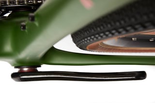 Underside of the green Kona Libre DL bottom bracket, with a black crank arm beside the tyre.