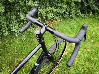 Cockpit of the Marin Four Corners showing the short stem, flared drop bar and Sora brake levers.