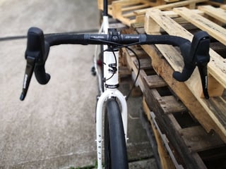 Surly Midnight Special cockpit with black bar tape and SRAM hydraulic shifters, viewed from the front.