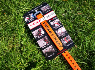 An orange Voile Strap on its retail card on grass, one of Keep Pedalling's must-have kit items for the Atlas Mountain Race.