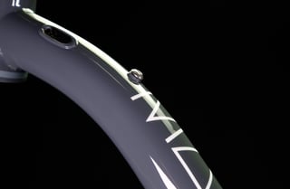 Element Grey Mason ISO down tube close-up with internal cable port, bottle bolt and lettering below the head tube.