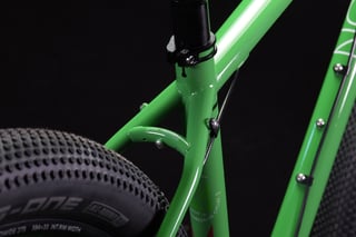 Mason ISO seat cluster in green with seatpost clamp, rack mounts and a wide Schwalbe G-One tyre.