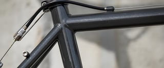 Close-up of the Surly Pack Rat's Grey Haze paint, anthracite with silver glitter, at a frame tube junction.