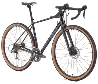 Pinnacle Arkose D2 gravel bike in black with a double chainset, disc brakes and tan wall WTB Riddler tyres.