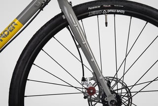 Sonder Santiago steel fork with multiple bolt-on mounts and a disc brake caliper, behind a 700x35c Panaracer tyre.