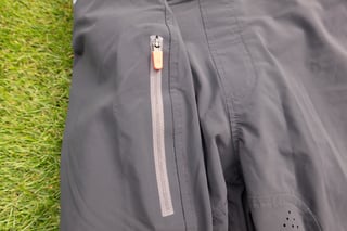 The zipped security pocket on the right leg of the Aussie Grit Apparel Ignite 2-in-1 shorts.
