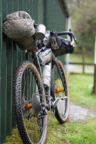 Salsa Warroad on knobbly WTB Sendero 47 tyres with a muddy seat pack, ready for the Wildcat 100 in Mid Wales.