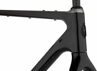 Cutthroat head tube and top tube with bolt-on bag mounts, the headbadge and a route map on the downtube.