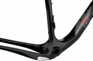 Close-up of the Cutthroat's bottom bracket shell, downtube badge and bolt-on mounting points.