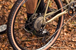 Rear wheel, cassette and rear derailleur of the Tout Terrain Vasco steel gravel bike on a DT Swiss G540 rim.