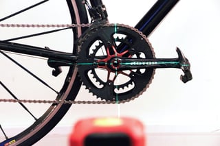 Laser alignment lines across a Rotor crank during a Foundation Fit bike fit at Cloud 9 Cycles.