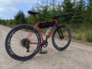 Fairlight Secan with Scope R4A wheels and Vittoria Terreno Zero tyres on a gravel track in Durris Forest.
