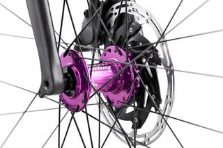 Purple Hope front hub and disc rotor on the Fairlight Secan's carbon fork.