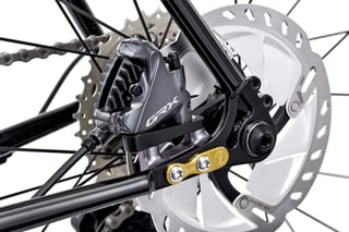 Shimano GRX rear brake calliper and gold Bentley dropout plate on the Fairlight Secan.