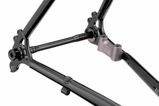 Grey CNC machined flat-mount brake bracket on the rear dropout of the Fairlight Secan frame.
