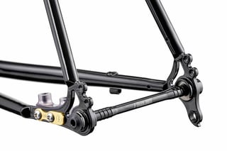 Fairlight Secan rear dropout with a gold Bentley flat-mount plate and Fairlight-branded thru-axle.